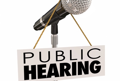 image of a mic and a public hearing sign