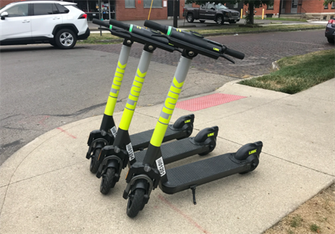 Link scooters on sidewalk
