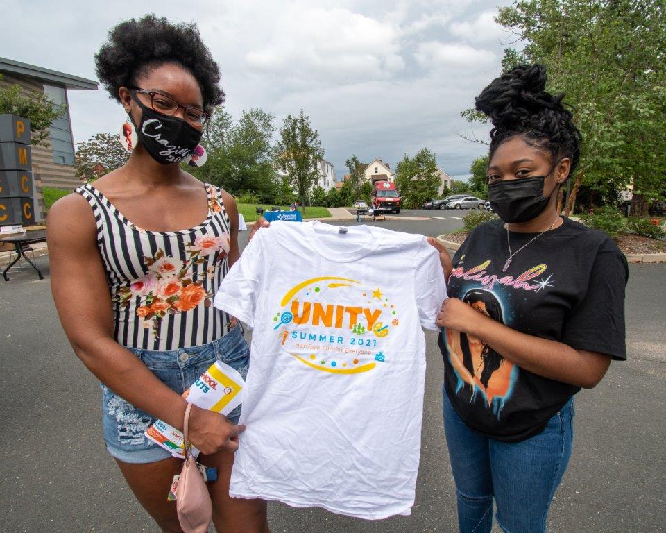 Girls holding Hartford Unity Tshirt