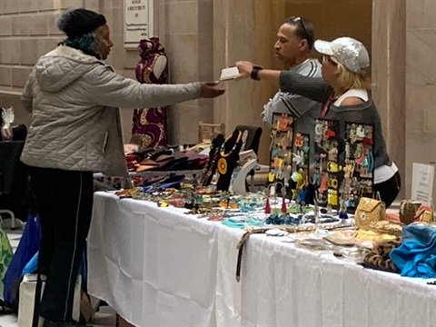 Image depicting local vendors and artisans selling goods in City Hall during a bazaar