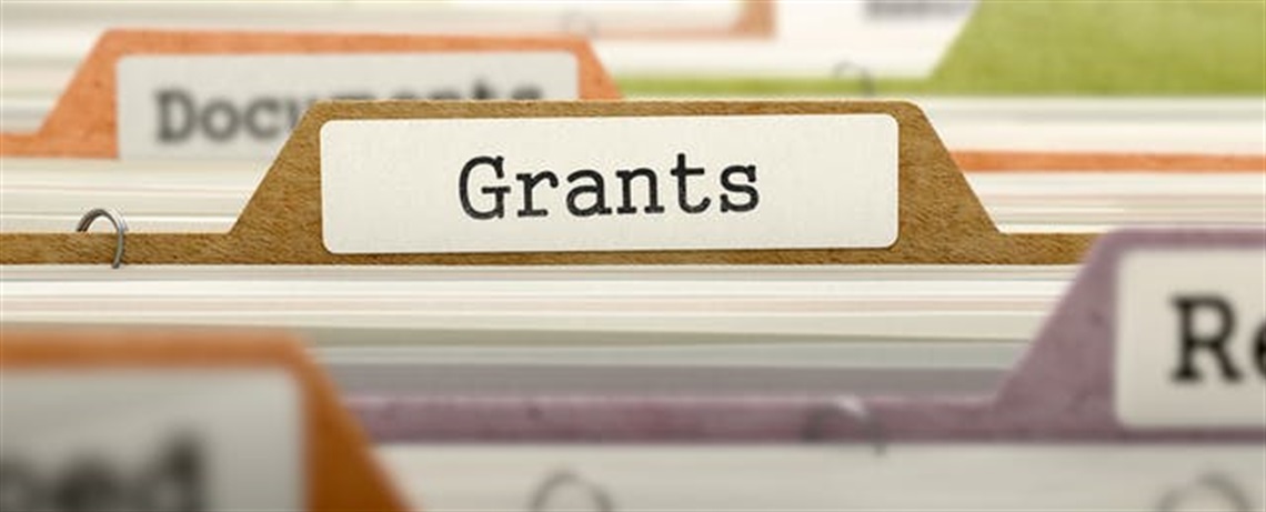 Image depicting the grants department with the word grant written on a folder